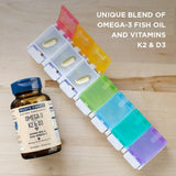 Wiley's Finest Omega-3 Fish Oil bottle with capsules on a wooden table