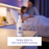 Wink Naturals Kids Liquid Melatonin Drops 1mg on a bedside table