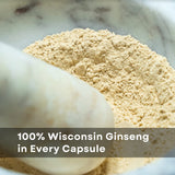 WISCONSIN ESTD 1978 BAUMANN GINSENG USA Ginseng Capsules on a wooden table