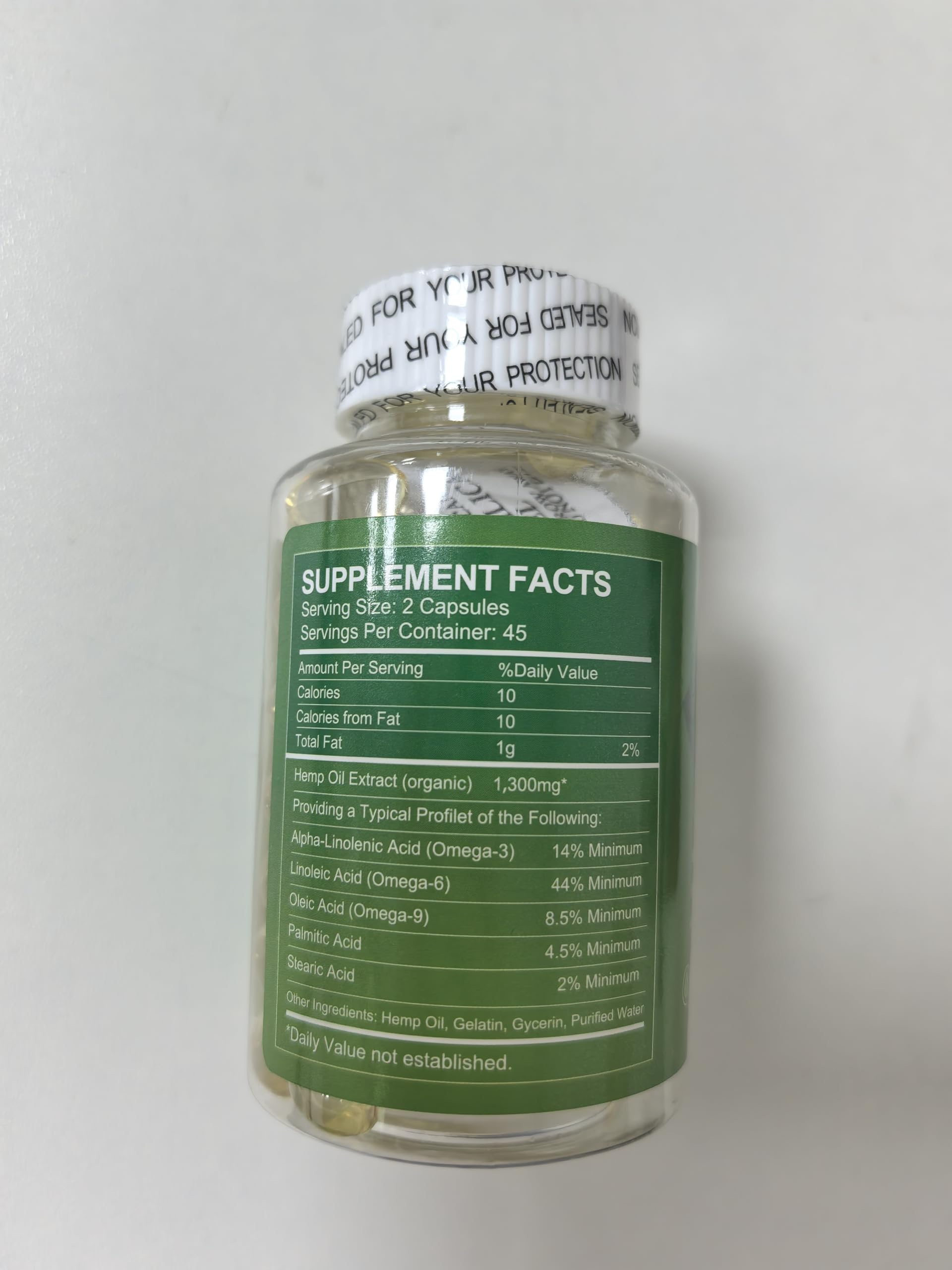 WOGORGT Hemp Oil Capsules lifestyle scene with a glass of water