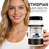 WOJJ Black Seed Oil Softgels lifestyle scene with a glass of water
