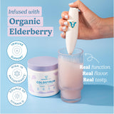 WONDERCOW Colostrum Powder with Elderberry in a glass of water