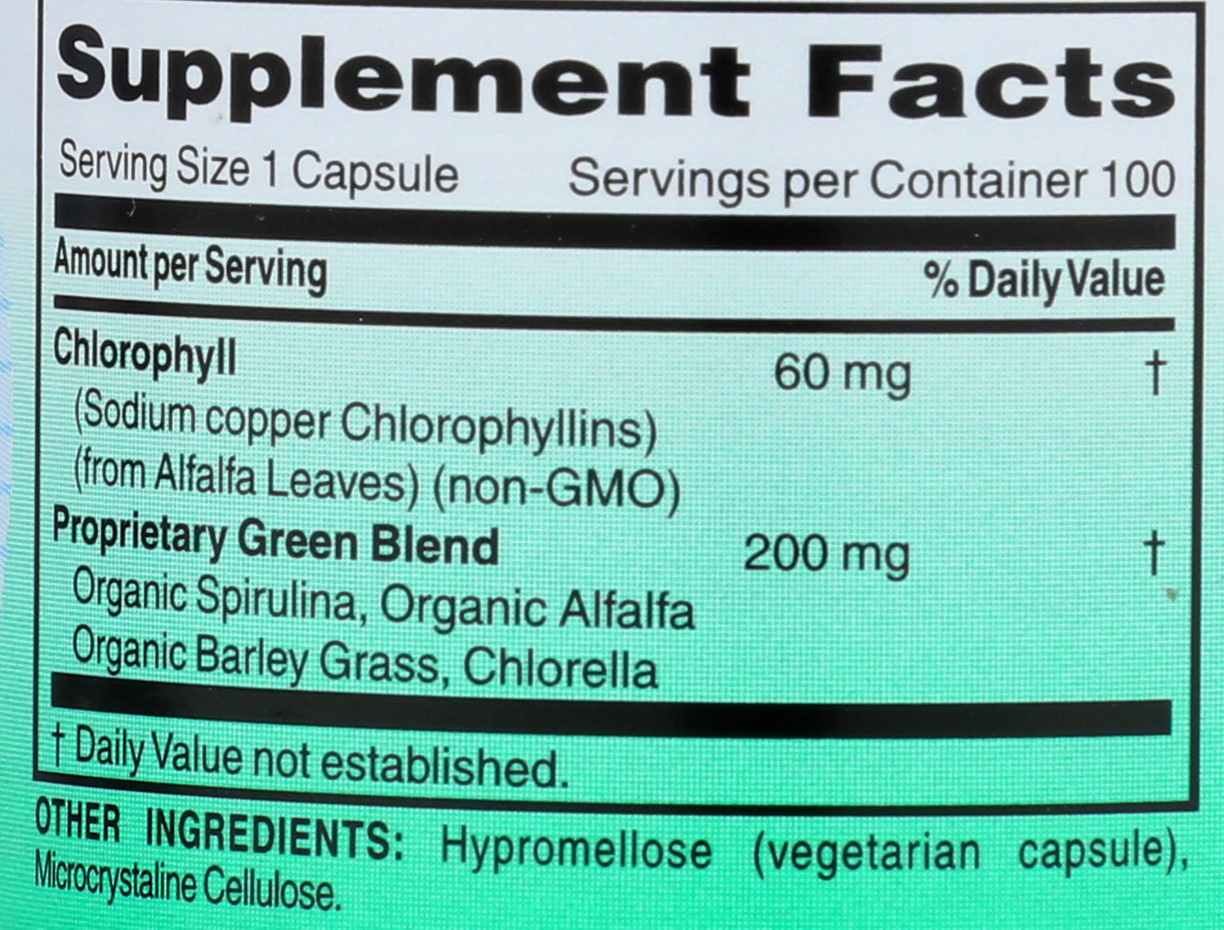 World Organic Chlorophyll 100 mg capsules with a measuring spoon
