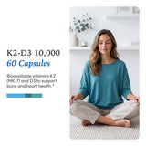 XYMOGEN K2-D3 10000 vitamin D3 and K2 capsules on a wooden table