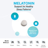 XYMOGEN Melatonin Peppermint tablets on a wooden table
