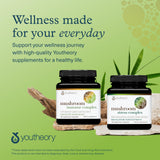 Youtheory daily wellness Support Mushroom Supplement capsules on wooden table