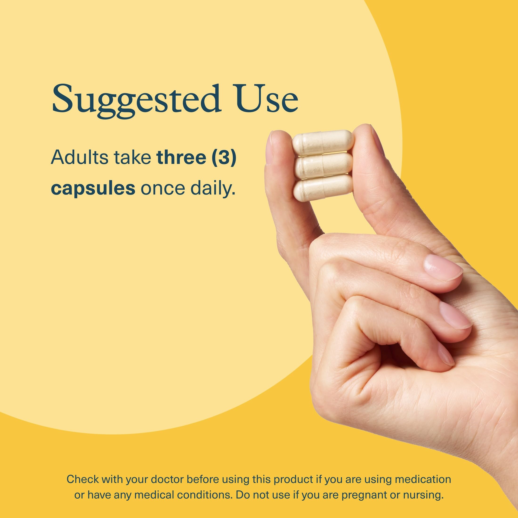 Youtheory Lion's Mane Plus capsules in a hand
