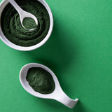 Yupik Chlorella Powder in a glass of water