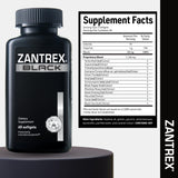 Zantrex Black Fat Burner Supplement on a table with a glass of water