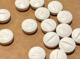 Zeebo Honest Placebo Pills blue-white capsules close-up
